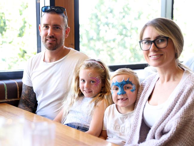 Nate Evans (5) and Harper Evans (7) pictured with their dad Morgan and mum Meagan after getting their face painted at The Country Club in Gledswood Hills. Picture: Damian Shaw