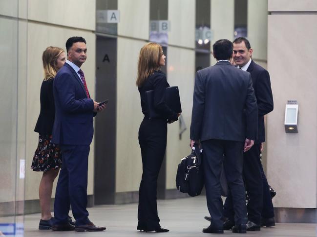 30/11/23: Magnis (US) managing director Hoshi Daruwalla(left) and Chair Frank Poullas and an unidentified woman arrive for their AGM. John Feder/The Australian