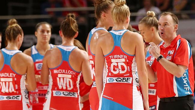 Swifts coach Rob Wright talks to his players during the match against the Thunderbirds.