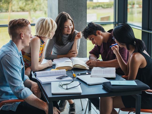 CM Postgraduate Studies feature - generic students at a library