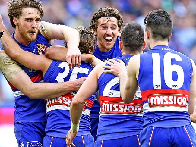 2016 AFL Grand Final match between the Western Bulldogs and the Sydney Swans at the Melbourne Cricket Ground (MCG), Melbourne, Australia on October 1, 2016. Western Bulldogs celebrate win Western Bulldogs Jordan Roughead Western Bulldogs Marcus Bontempelli Picture: Tim Carrafa