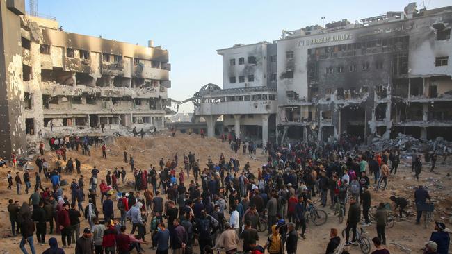 Palestinians inspect the damage at Gaza's Al-Shifa hospital after the Israeli military withdrew from the complex housing the hospital.