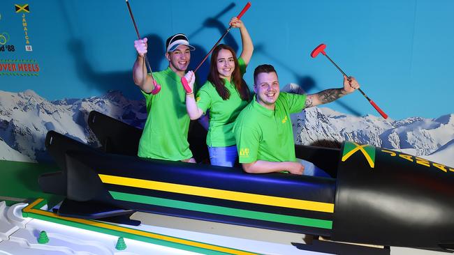 Staff Nick Griffin, Jacqueline Vella and Lachie Strasser jump in the Jamaican bobsleigh at Holey Moley Eastland. Picture: Josie Hayden