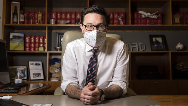 Come together: Agriculture Minister David Littleproud dons a face mask at Parliament House in Canberra. Picture: NCA Newswire/Gary Ramage