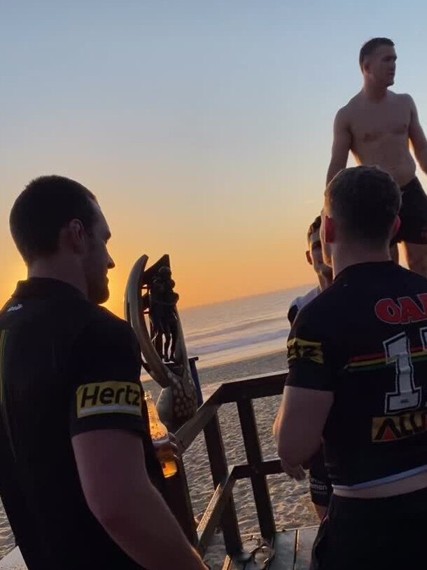 Penrith Panthers celebrate at the beach