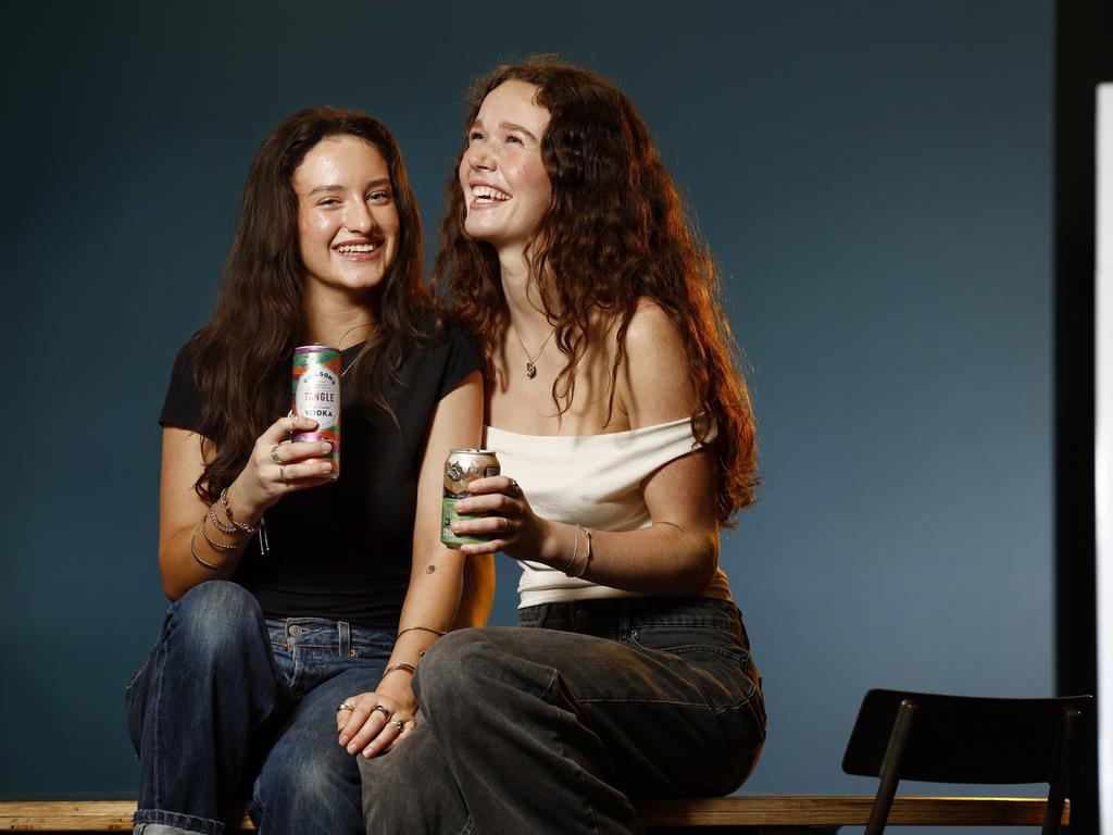 Grace O’Keeffe and Miranda Thomas drinking flavoured vodka and alcoholic ginger beer, which could both be in the sights of the liquor regulator. Picture: Richard Dobson