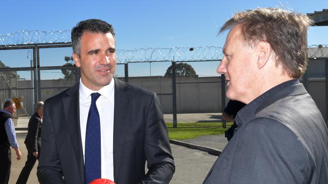 Minister for Correctional Services Peter Malinauskas and Port Adelaide FC CEO Keith Thomas at Yatala Prison yesterday. Picture: AAP