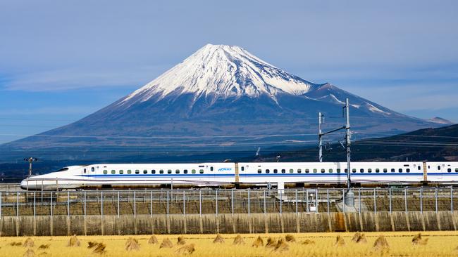 A bullet train passes below Mount Fuji. Picture: iStock