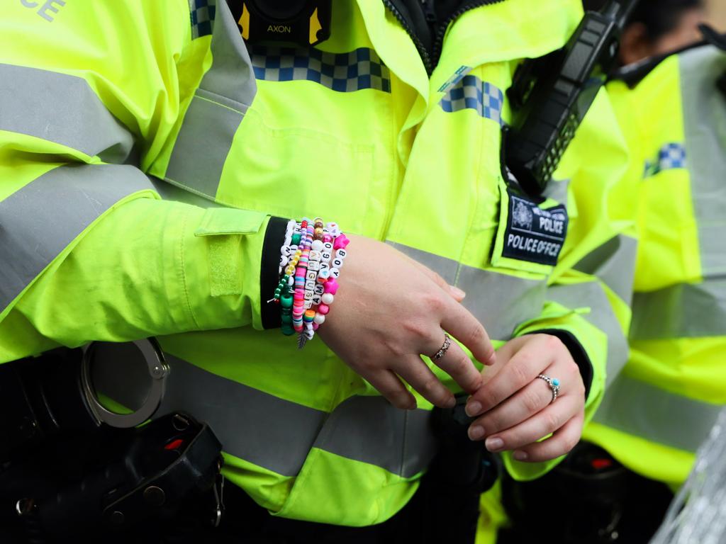 A police officer speaks with Taylor Swift fans outside Wembley Stadium ahead of her performance in London. Picture: Getty Images