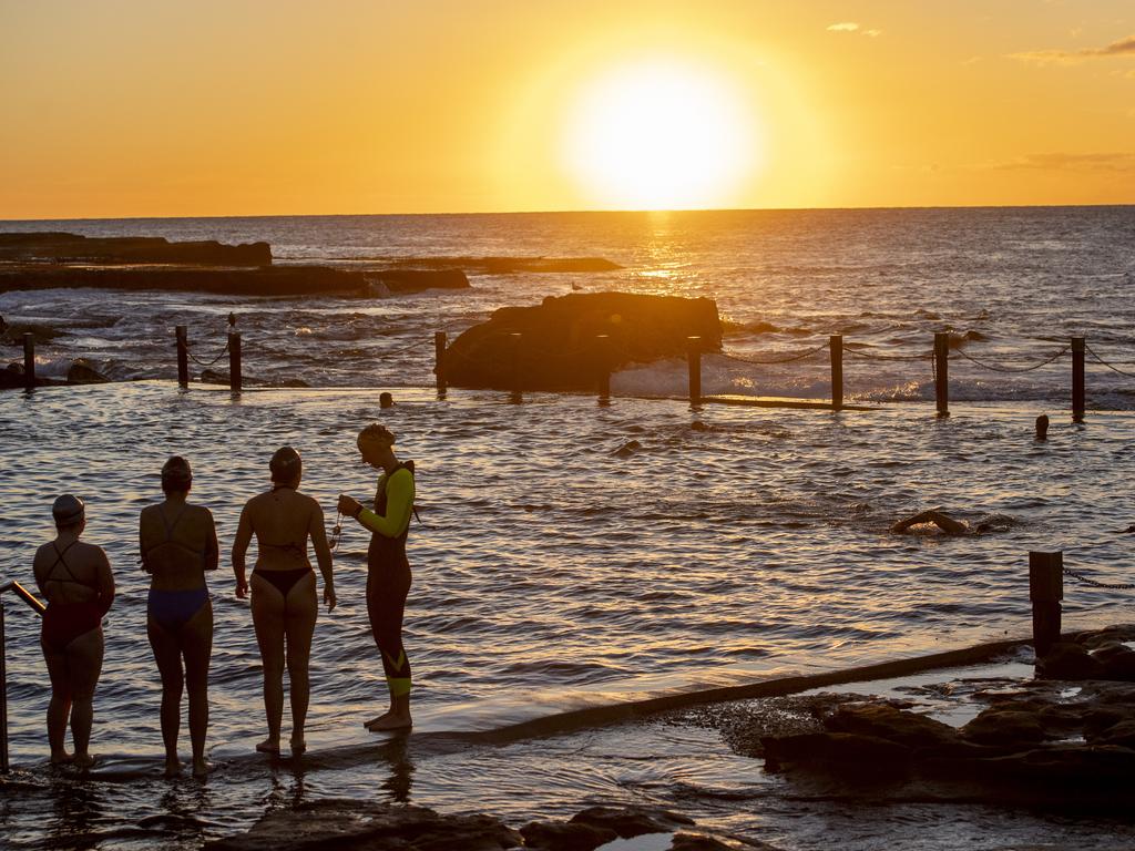Early morning beachgoers enjoy the sunrise at Mahon Pool in Maroubra. Photo Jeremy Piper