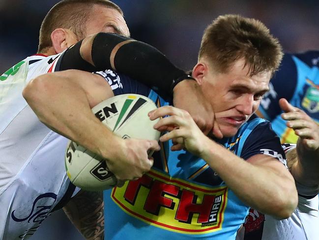 GOLD COAST, AUSTRALIA - JULY 15:  Alexander Brimson of the Titans is tackled during the round 18 NRL match between the Gold Coast Titans and the Sydney Roosters at Cbus Super Stadium on July 15, 2018 in Gold Coast, Australia.  (Photo by Chris Hyde/Getty Images)