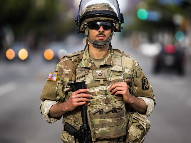 A member of the National Guard stands at the intersection of Hollywood Boulevard and Highland Avenue. Picture: /Ringo H.W. Chiu