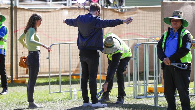 Security searches a patron at the entrance of last year’s Splendour in the Grass festival. Picture: Nigel Hallett