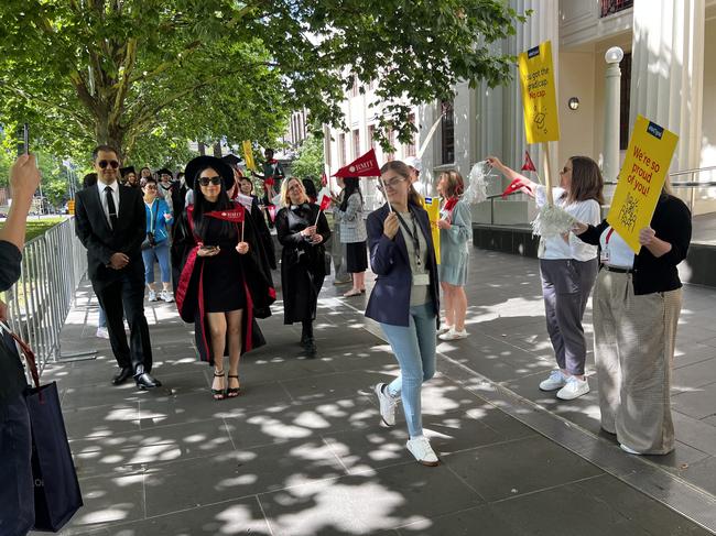 Graduates in the graduation parade walk around the RMIT University Melbourne Campus on Wednesday, December 18, 2024. Picture: Jack Colantuono