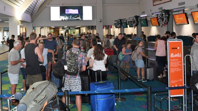 Those who managed to get a flight back to Sydney at the Darwin airport on Monday afternoon. Picture: Katrina Bridgeford.