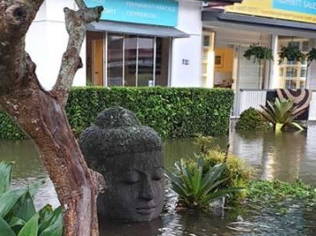 Flooding around a Buddha statue in Byron. Picture: