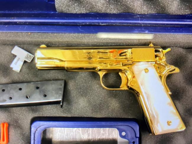 The gold-plated gun allegedly found in a 28 year-old American woman’s luggage.