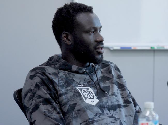 Jo Lual-Acuil meets with Melbourne United assistant coach Rhys Carter andand staff on his return to the club. Picture: Behind the Blue/Melbourne United