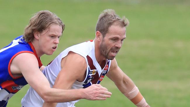 Queenscliff’s Lachie Kidd tackles Modewarre veteran Josh Finch. Picture: Mark Wilson