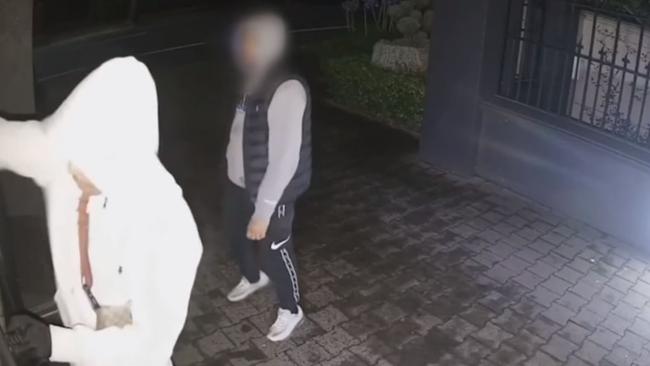 CCTV shows a gang of up to five people trying to break into homes in the hours before the home invasion at Dr Michael Yung's home on James St in Gilberton.