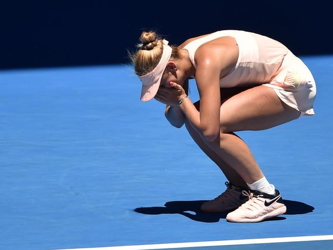 Ukraine's Marta Kostyuk celebrates her victory against Australia's Olivia Rogowska during their women's singles second round match on day three of the Australian Open tennis tournament in Melbourne on January 17, 2018. / AFP PHOTO / PETER PARKS / -- IMAGE RESTRICTED TO EDITORIAL USE - STRICTLY NO COMMERCIAL USE --
