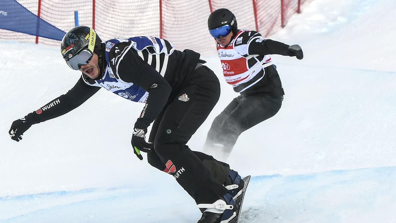 Germany's Paul Berg (L) and Australia's Adam Lambert (R) competing in a Snowboard Cross World Cup.