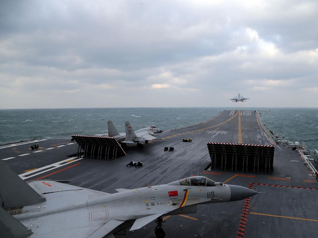 Chinese J-15 fighter jets being launched from the deck of the Liaoning aircraft carrier during military drills in the Yellow Sea, off China's east coast. Picture: Xinhua