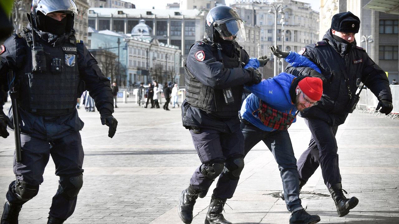 Police officers in central Moscow detain a man during a protest against Russia's invasion of Ukraine. Picture: AFP