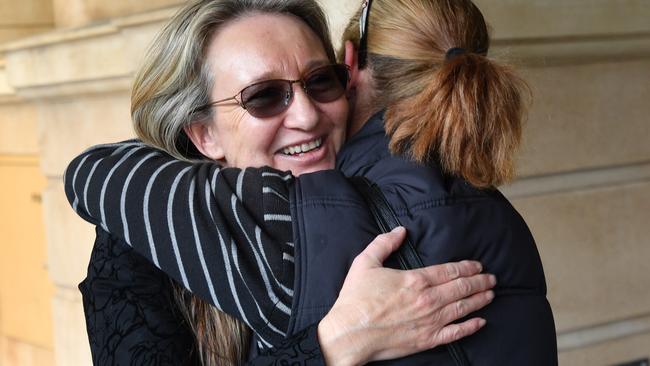 Jenny Hallam is hugged by a supporter outside the District Court. Picture: AAP Image/David Mariuz