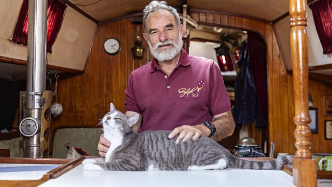 SYDNEY, AUSTRALIA, NOVEMBER 22, 2023. Sylph VI skipper and owner Robert âBobâ Williams with his cat Oli who will sail with Bob in the Sydney to Hobart yacht race on board Sylph VI. Photographer: Adam Yip