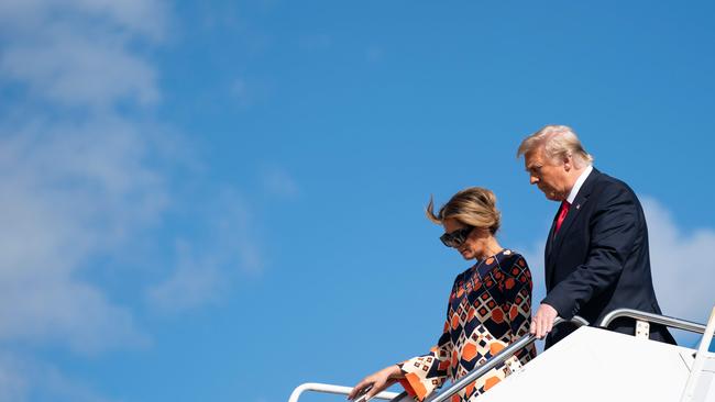 Donald Trump and Melania Trump step off Air Force One as they arrive at Palm Beach International Airport in Florida on January 20. Picture: AFP