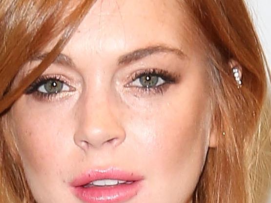 LONDON, ENGLAND - JUNE 16: Lindsay Lohan attends the Moschino show during the London Collections: Men SS15 at Lindley Hall on June 16, 2014 in London, England. (Photo by Tim P. Whitby/Getty Images)