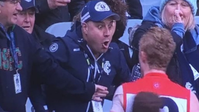 Clayton Oliver exchanges words with a Carlton supporter.