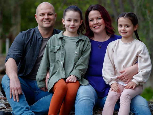 Elyse and Josh at home with daughters Aria 8 and Estelle 6 in Tea Tree Gully. Picture Matt Turner.