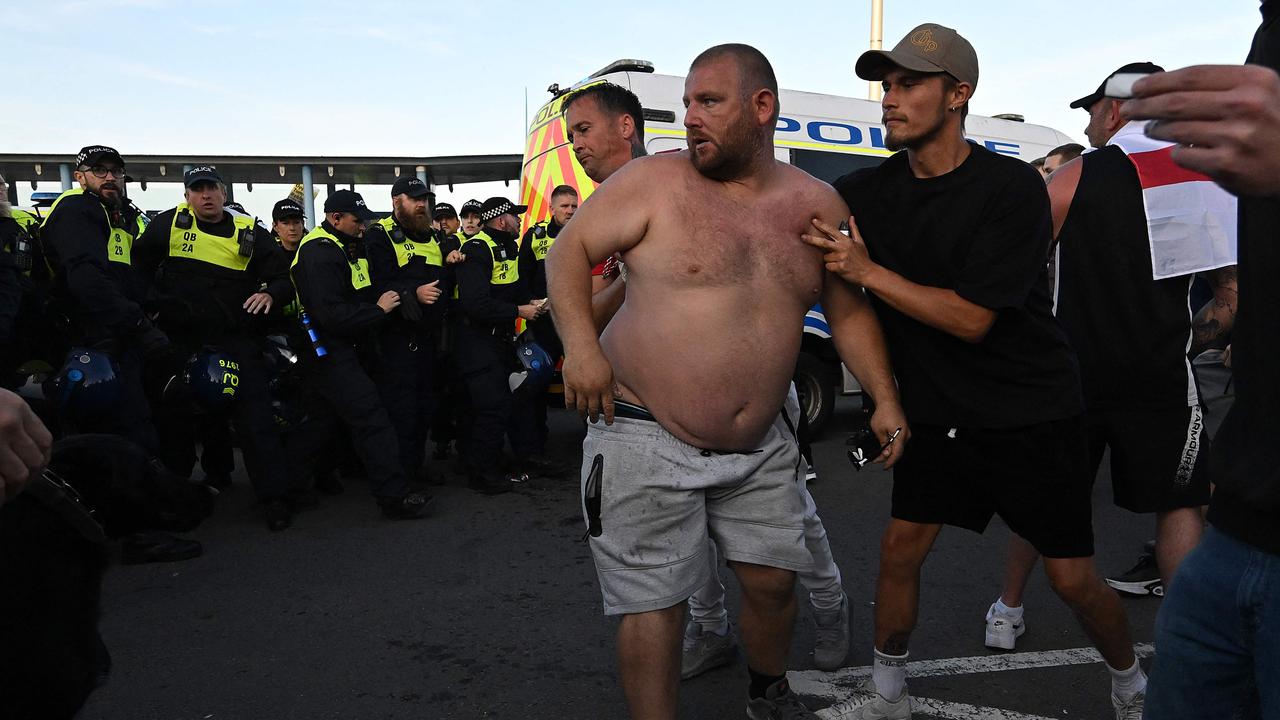 Protesters face off with police officers in Weymouth, on the southwest coast of England. Picture: AFP