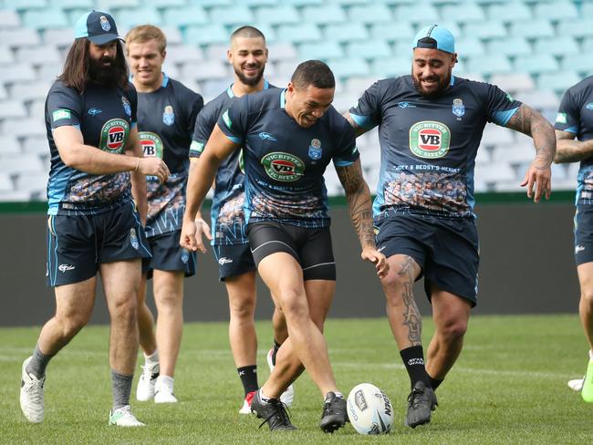 Tyson Frizell and Andrew Fifita jokingly try to kick a ball during their captain’s run. Picture: AAP