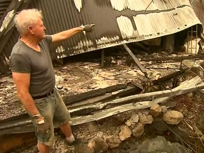 Ron Coote outside his Lake Conjola home that burnt down during the fires. Picture: Ch 9