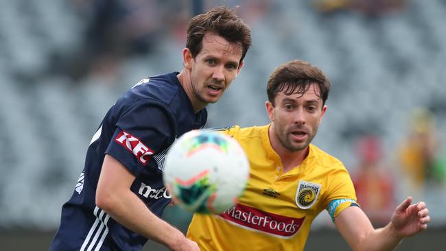 Robbie Kruse of Melbourne Victory contests the ball with Tommy Oar of the Central Coast Mariners Picture: Getty Images