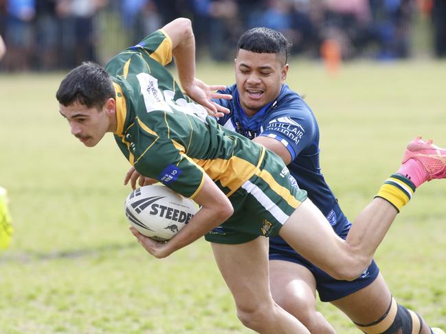 Latrell Fing slips out of a tackle. Photographer: Warren Gannon Photography
