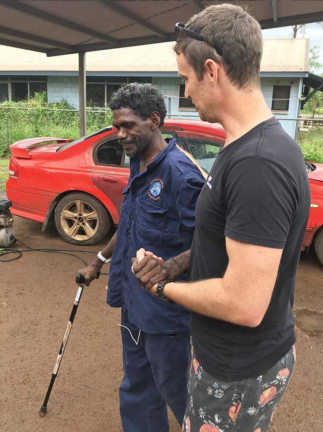 Bakala is helped by MJD Foundation's Jacob McCue. Picture: supplied