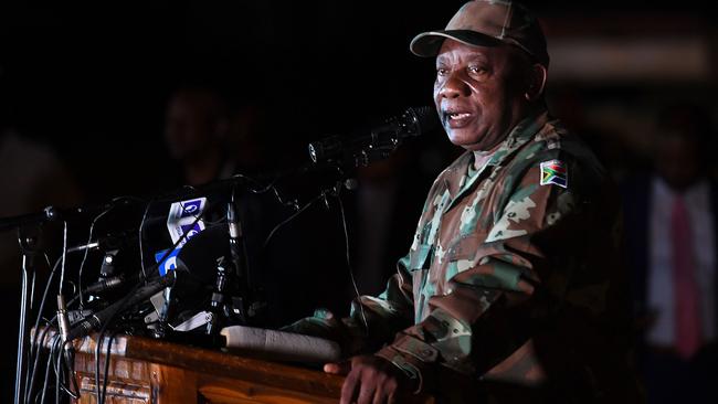 South African President Cyril Ramaphosa, dressed in military fatigues, talks to soldiers of the South African National Defence Force (SANDF) at the Doornkop Military Base in Soweto. Picture: AFP