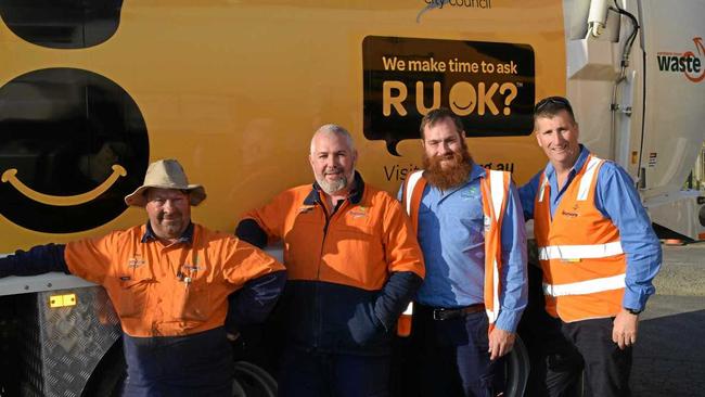 COMMITMENT: From left Tony Kennedy, Ian Thompson, Tom Moodie and Jody Hinds in front of Lismore City Council's new R U OK garbage truck. Picture: Jackie Munro