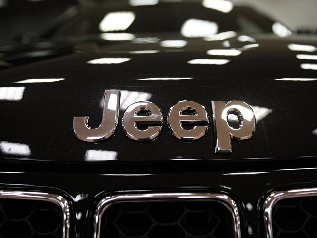 A picture shows the logo of auto maker Jeep in a cars dealer on January 12, 2017 in Saluzzo, near Turin. The United States on January 12, 2017 charged Fiat Chrysler with using software on its trucks to evade emissions standards on about 104,000 vehicles, an accusation the company immediately denied. The Environmental Protection Agency said the undisclosed software on the 2014 to 2016 models of Jeep Grand Cherokees and Dodge Ram 1500 trucks sold in the United States allowed the vehicles to emit more nitrogen oxides than permitted. / AFP PHOTO / MARCO BERTORELLO