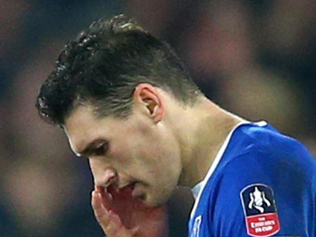 LIVERPOOL, ENGLAND - MARCH 12: Gareth Barry (L) of Everton walks off the pitch after sent off by referee Michael Oliver (R) during the Emirates FA Cup sixth round match between Everton and Chelsea at Goodison Park on March 12, 2016 in Liverpool, England. (Photo by Clive Brunskill/Getty Images)