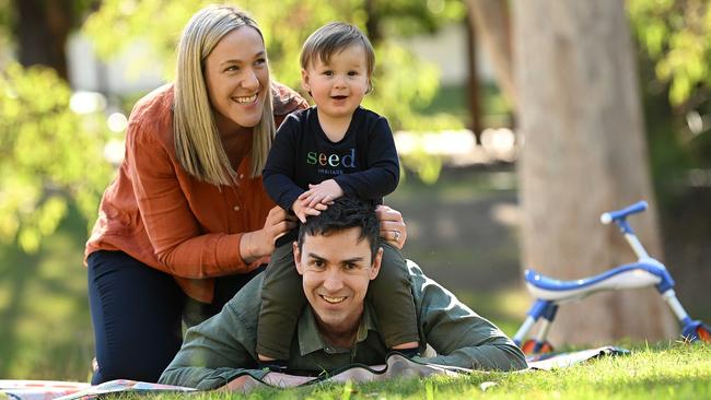 Angus Cave and wife Rebecca Schulz with 16-month-old son Noah, who was conceived via IVF using a sperm sample taken and put into cryostorage in 1996. Picture: Lyndon Mechielsen