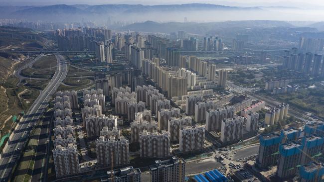 An aerial view of construction sites and new residential developments in the Nanchuan area of Xining, Qinghai province.