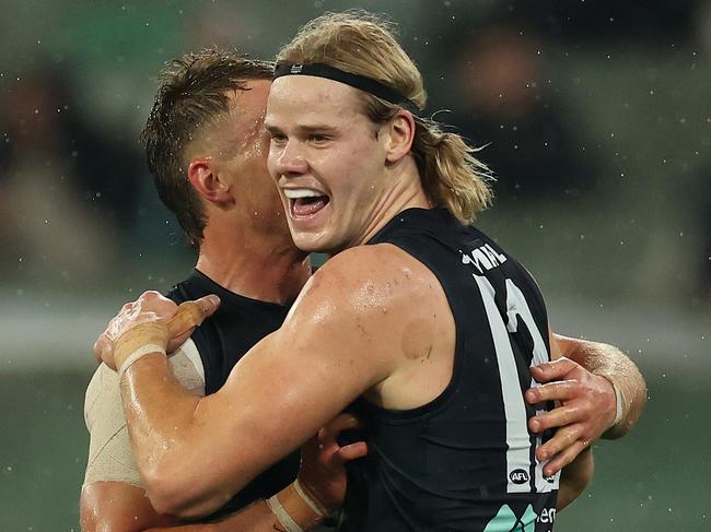 MELBOURNE, AUSTRALIA - MAY 09: Tom De Koning of the Blues celebrates after scoring a goal during the round nine AFL match between Carlton Blues and Melbourne Demons at Melbourne Cricket Ground, on May 09, 2024, in Melbourne, Australia. (Photo by Robert Cianflone/Getty Images)