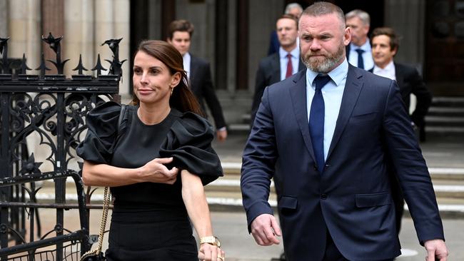 Coleen Rooney leaves court with husband Wayne. Picture: Getty Images.