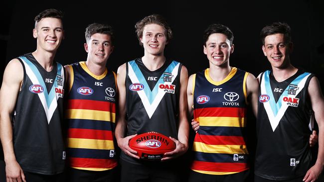 Draft stars ... from left, Connor Rozee, Edward McHenry, Xavier Duursma, Chayce Jones and Zak Butters show off their new colours. Pic: AAP