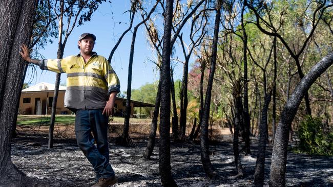 Grant Hopkins surveys the damage the bushfire in Noonamah on Monday night caused to his property. Picture: Che Chorley